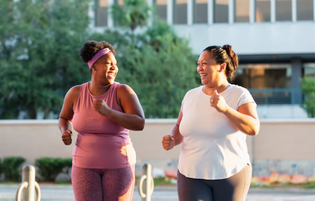Smiling woman running outdoors in natural light